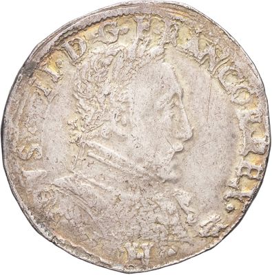 une pièce d'argent portant une tête d'homme