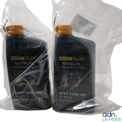 two bottles of motor oil sitting on a plastic bag
