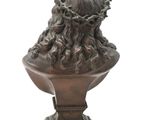 bronze bust of a woman with a crown of thorns on her head