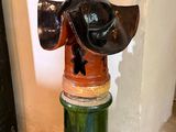 a fire hydrant that has a hat on top of it