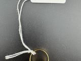 a close up of a gold ring with a black stone on it