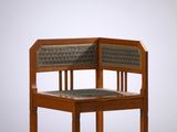 an image of a wooden chair with a woven seat on a white background