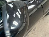 an image of a black car parked on the side of the road