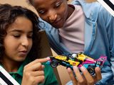 a woman and a young girl playing with a toy car