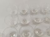 a lot of empty wine glasses sitting on a table