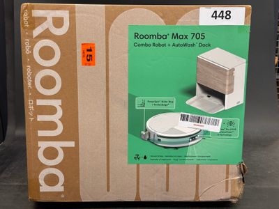 a cardboard box with a picture of a roomba on it