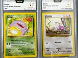 two pokemon cards are on display in a plastic case