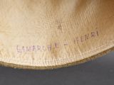 a close up of a hat with writing on it