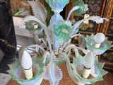 a glass chandelier that is sitting on the floor
