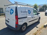 a van that is parked on the side of the street