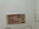 a close up of a white electronic device with buttons on it