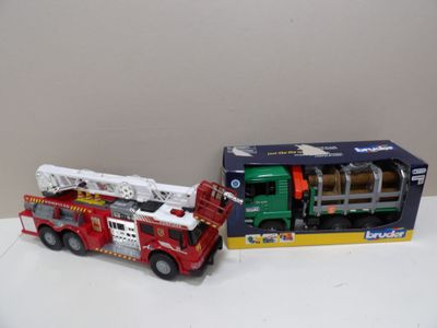 a toy firetruck and a toy firetruck in a box