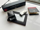 a box of cigarettes and a wallet sitting on a table
