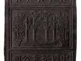 a close up of a stone plaque on a white background