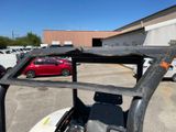 an image of a golf cart parked in a parking lot