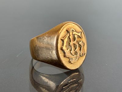 an image of a gold signet ring with a lion on it