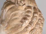 a statue of a woman with a flower in her hair