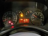 a close up of a car dashboard with a speedometer