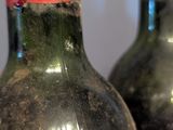two bottles of wine that are sitting on a table