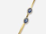 une paire de boucles d'oreilles « ear climbers » en saphir et diamants