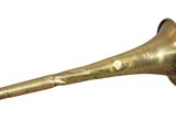 an old brass trumpet with a silver bell on a white background