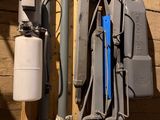 a lot of tools hanging on the wall next to each other
