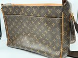 a close up of a louis vuitton cross body bag
