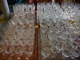 a lot of empty wine glasses sitting on a table