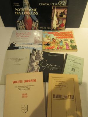 several books are sitting on a table next to each other