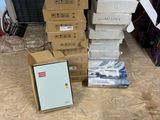 a pile of boxes sitting on the floor next to a picture frame