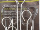 four pieces of scissors are in a package on a white surface