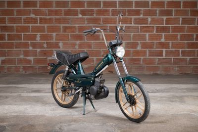 a motorcycle that is parked in front of a brick wall