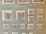 an old book with a bunch of different type of letters on it