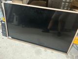 a television that is sitting on the floor in the warehouse
