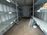 many shelves in the back of a truck that is empty
