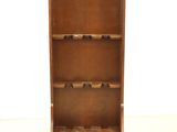 an image of a wooden wine rack with wine bottles in it