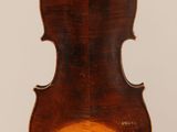 an old violin with a wooden back and a long neck