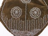 brown velvet purse with beaded flowers on it on a white surface
