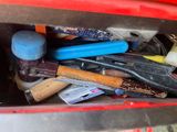 a red box with tools in it and a hammer in it