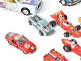 several toy cars are lined up in a circle on a white surface