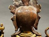 a statue of a woman holding a bird in her hand