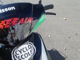 a close up of a motorcycle with a sticker on it