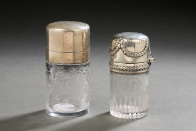 pair of silver and glass salt and pepper shakers on a gray surface