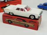 two toy cars that are sitting on top of each other