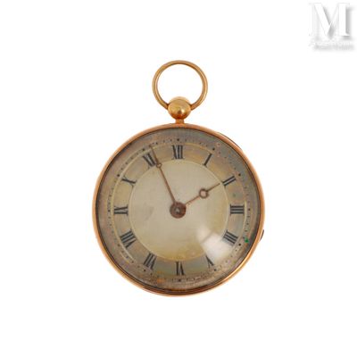 une montre de poche en or avec des chiffres romains sur le cadran