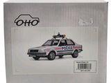 a box with a toy police car inside of it