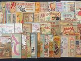 many old children ' s books on display on a table