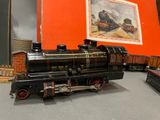 a toy train on the table with other toy trains in the background