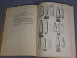 an open book with a drawing of different objects