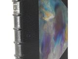 an image of a black book with a blue and purple design on it